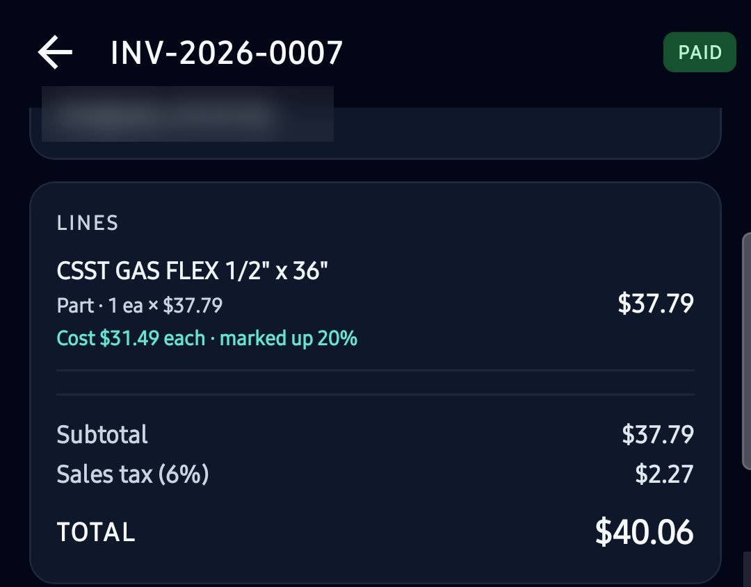 The same invoice marked PAID, with the part line, subtotal, sales tax and total