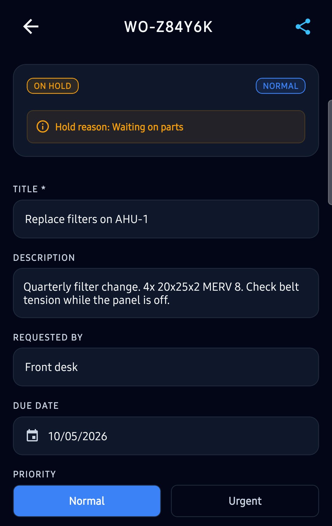 A work order to replace the filters on AHU-1, On Hold with the reason Waiting on parts, with its description, who requested it, the due date and the priority